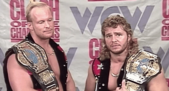 Backstage, WCW tag champions Austin and Pillman cut a promo in front of a Clash of The Champions backdrop.