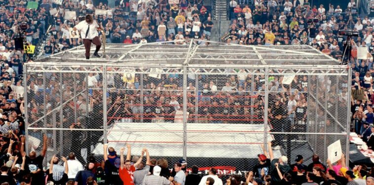 The Undertaker and Mankind in a WWE Hell in a Cell Match in one of wrestling's most famous gimmick matches (Feature Image)