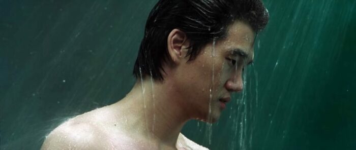Woo-jin with water falling on him