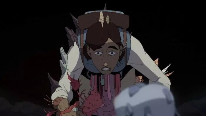 a woman is shown with bone spurs sticking out of her arm and head and her abdominal cavity emptying to the ground in Scavenger's Reign