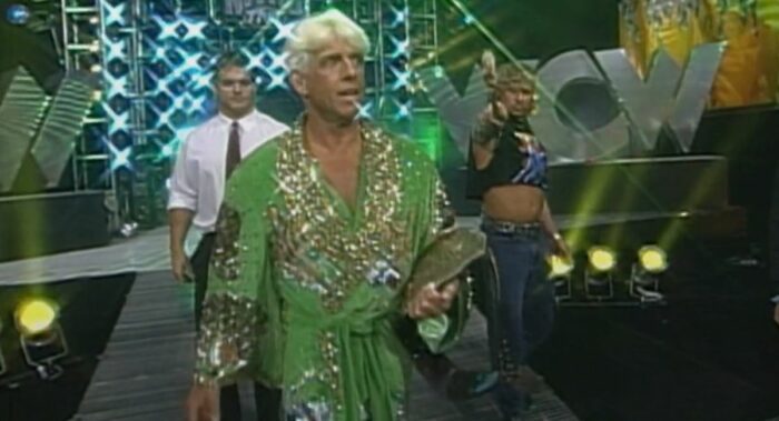 Ric Flair strolls the WCW Monday Nitro ramp, accompanied by fellow Horsemen Chris Benoit and Brian Pillman