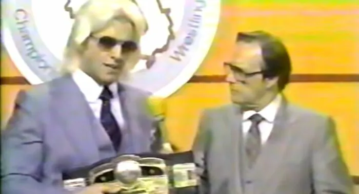 Ric Flair addresses Gordon Solie on the Georgia Championship Wrestling set.