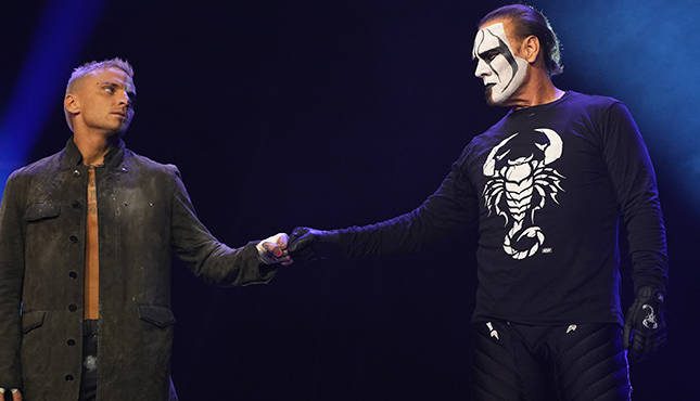 Sting and Darby Allin share a fist bump
