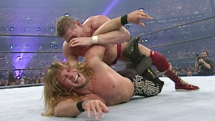 Chris Jericho struggles to get out of the Regal Stretch at WrestleMania X7