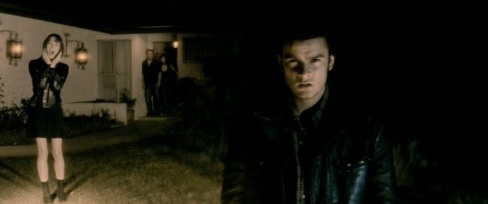 Split-screen with a woman looking scared, caught in car headlights, and a man staring ominously in shadow.