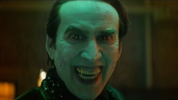 Dracula (Nicolas Cage) snarls with a smile, ready to eat, in the film, "Renfield" (2023).