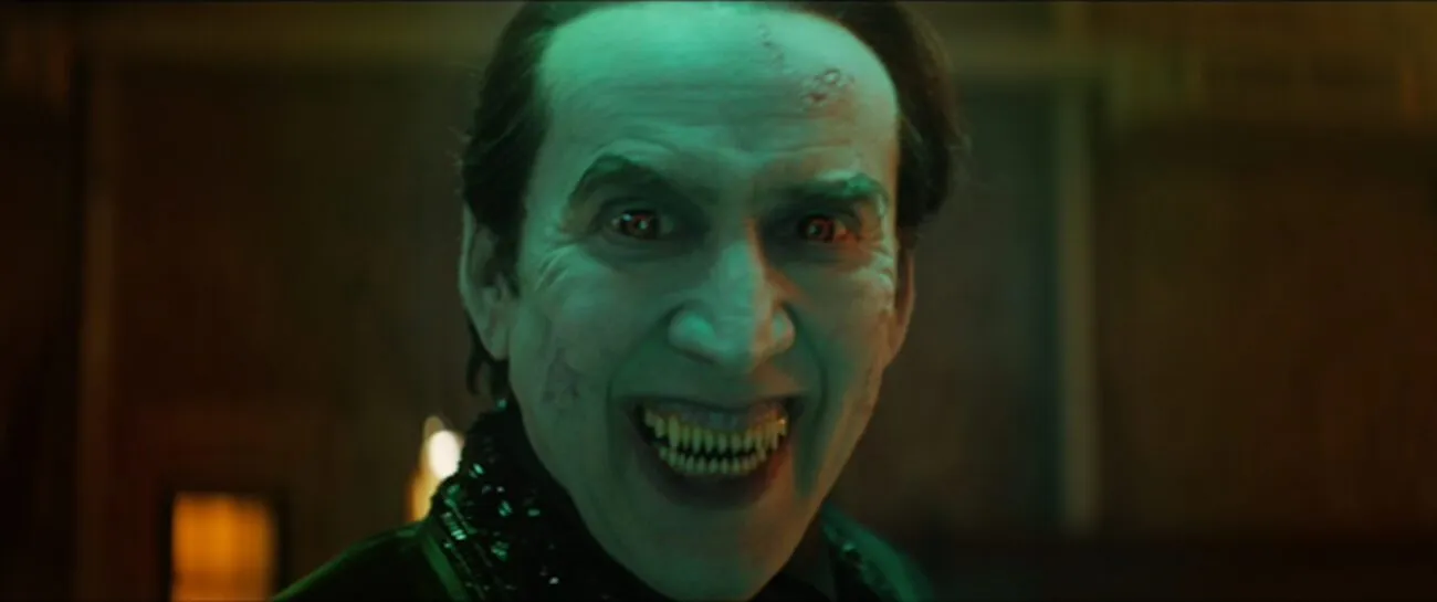 Dracula (Nicolas Cage) snarls with a smile, ready to eat, in the film, "Renfield" (2023).