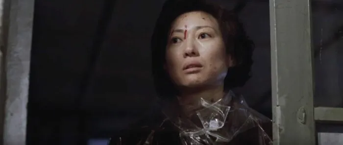 A woman looking traumatized