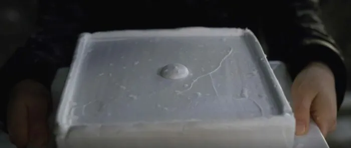 A cake covered with white frosting