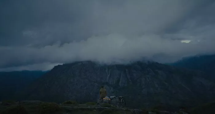 A hill with a cloud over it