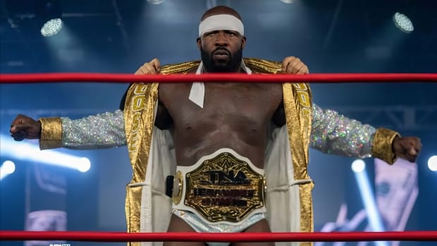 Moose displays his TNA World Heavyweight Championship belt