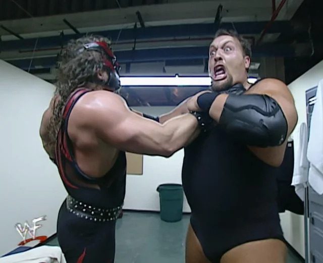 Kane puts a choke on a terrified Big Show at WrestleMania X7
