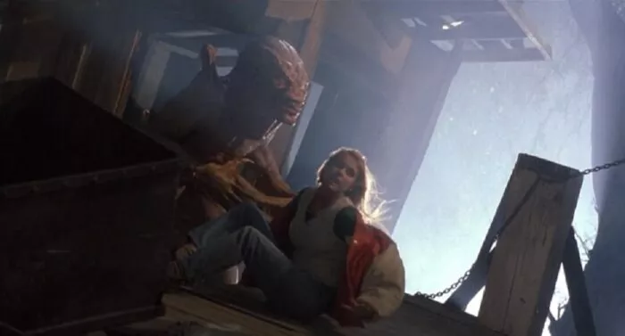 A monstrous alien jumps out of the ground ready to attack its next victim