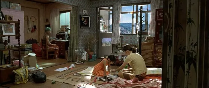 A girl playing a game with a woman