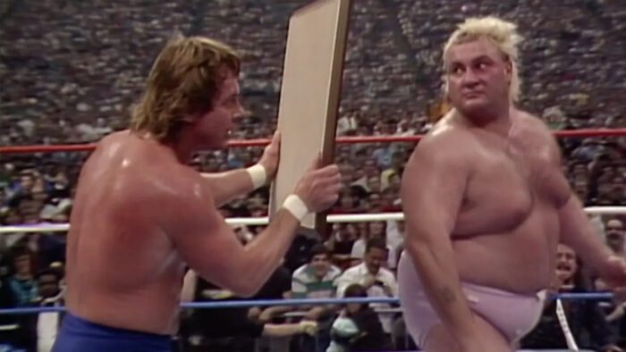 Roddy Piper shows Adrian Adonis a mirror at WrestleMania III