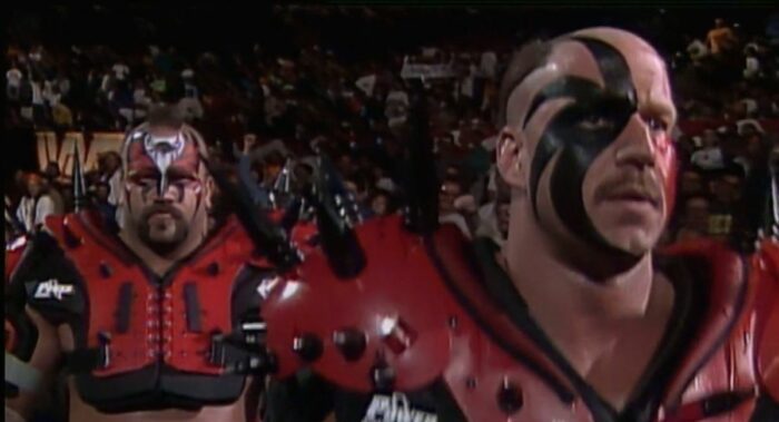 The Legion of Doom stride with determination to the ring.
