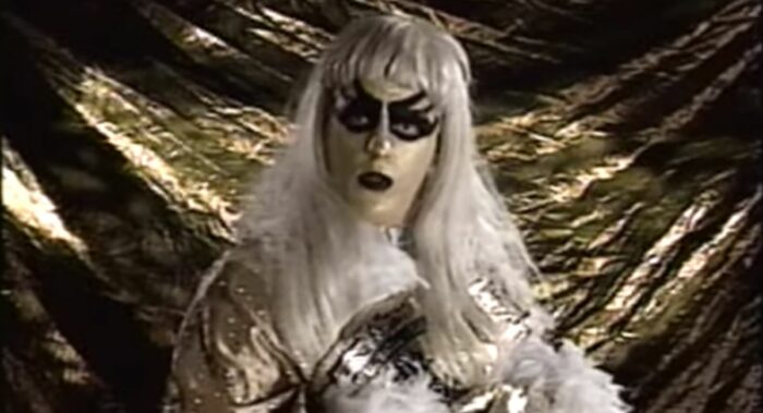 Goldust poses with the Intercontinental Title against - what else? - a gold backdrop