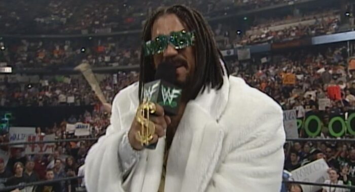 The Godfather spits on the mic at WrestleMania 2000