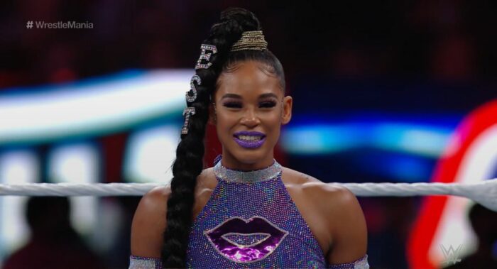 Bianca Belair smiles for the crowd.