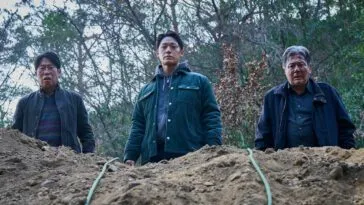 Three people looking down