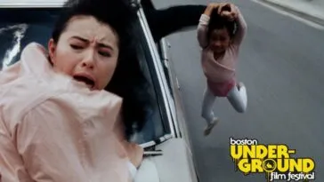 A woman clings to the hood of a car as an arm holds up a child by the hair out the window in Fatal Termination