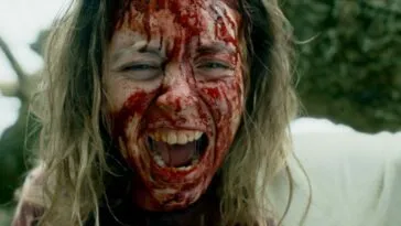 A woman with blood on her face