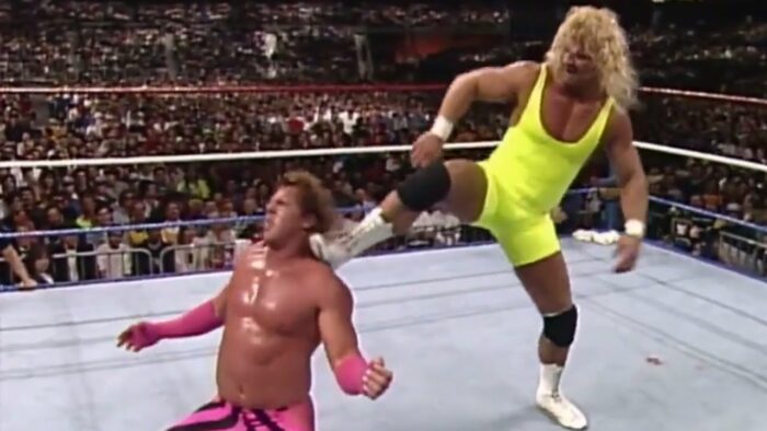 Mr Perfect kicks Brutus Beefcake right in the shouler