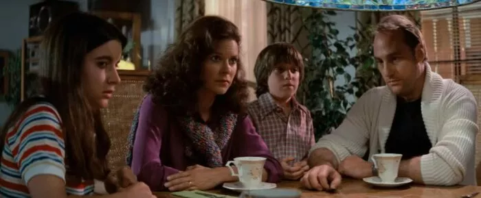 A family sitting at a table