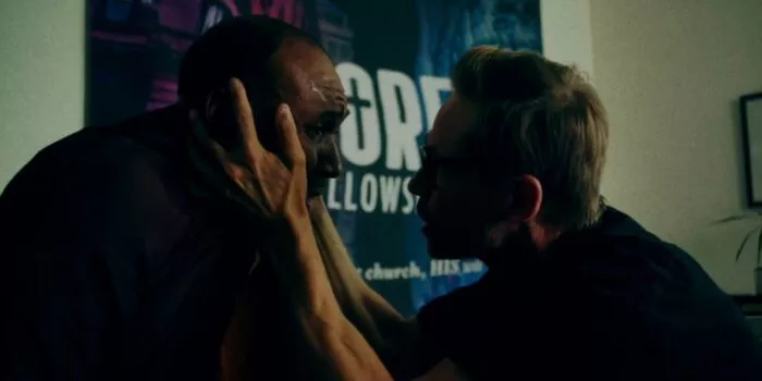 A man calming down another man