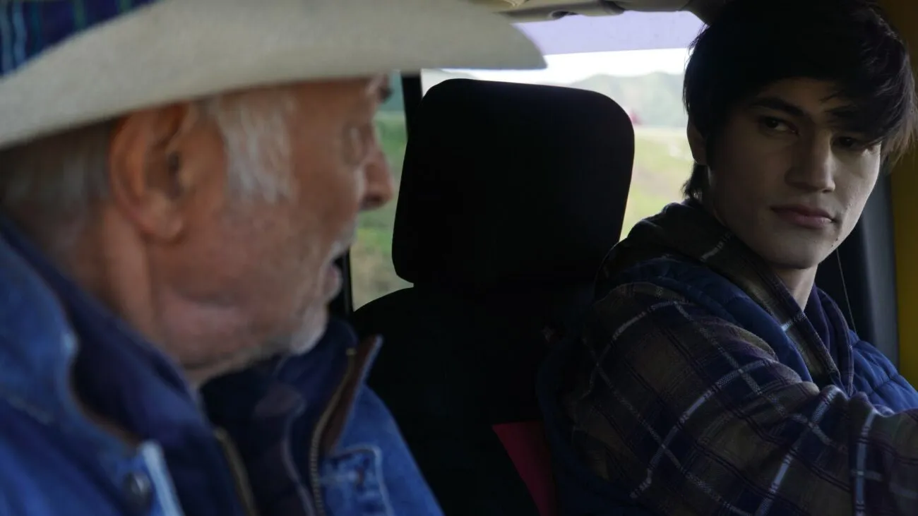 Two people talking in a car
