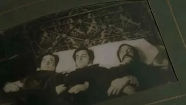 A picture of three dead people