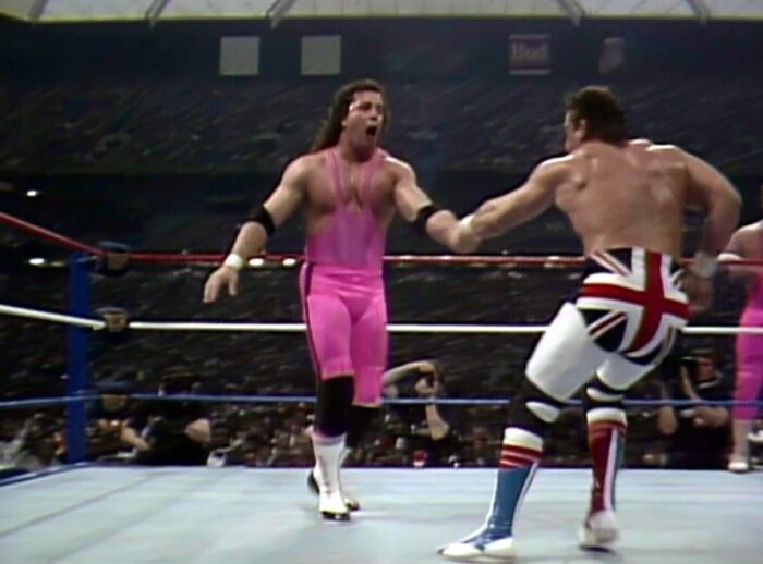 Dynamite Kid goes to Irish whip Bret Hart at WrestleMania III