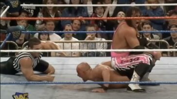 Bret Hart has a bloody Steve Austin in a sharpshooter at WrestleMania 13
