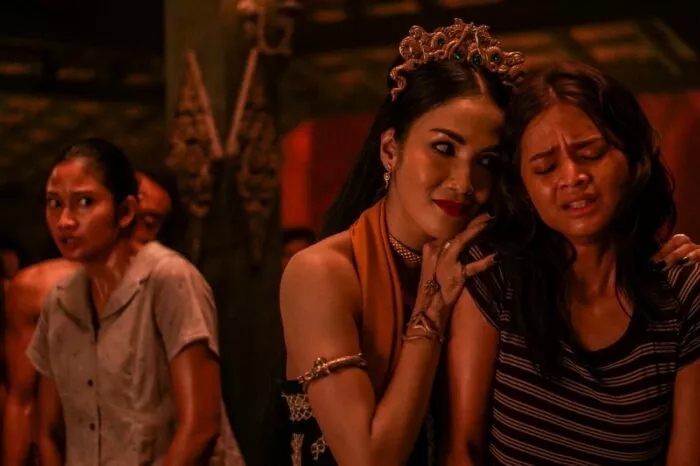 A woman embracing another woman
