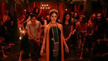 A woman in front of a crowd