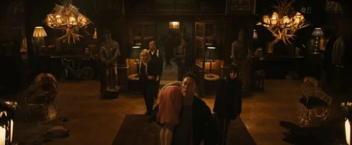 People walking into a house