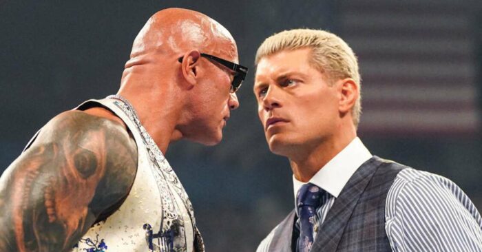 The Rock and Cody Rhodes facing off in the ring
