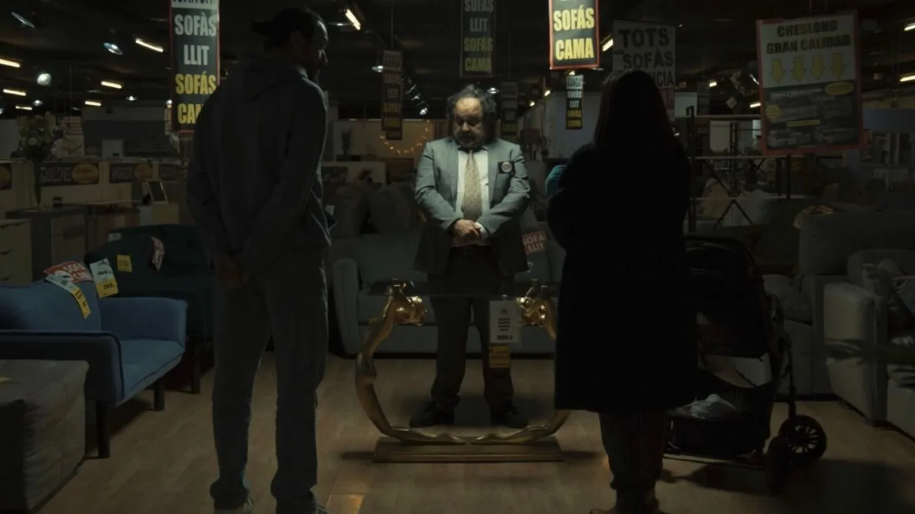 A salesman selling a table to a couple