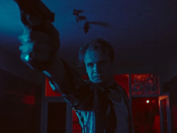 A man pointing a gun