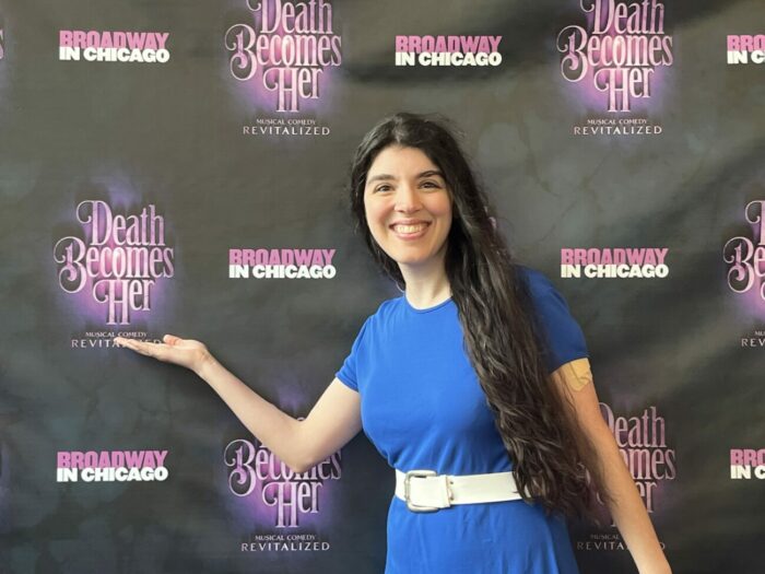 Jamie Lee smiles against the backdrop for the premiere of the musical, "Death Becomes Her," from Broadway in Chicago.