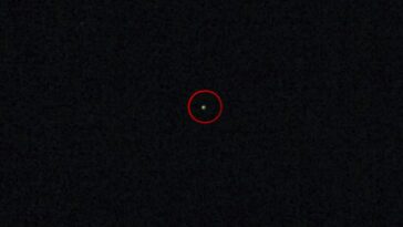 A still image of the flashing light seen in the sky, the light is circled