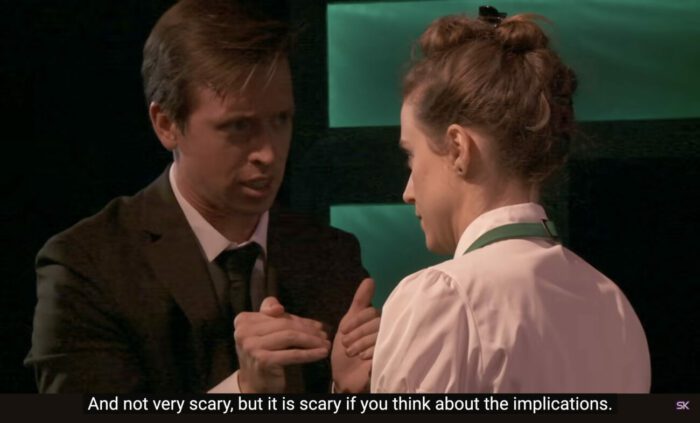 Paul Matthews (Jon Matteson) says to Emma Perkins (Laura Lopez), "And not very scary, bit is is scary if you think about the implications," in the musical, "The Guy Who Didn't Like Musicals."