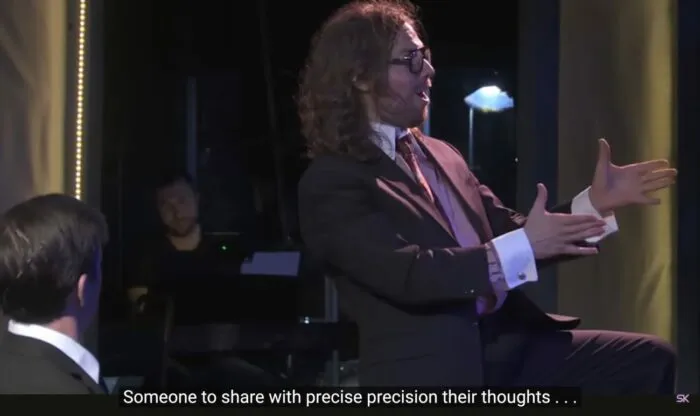 Mr. Davidson (Jeff Blim) sings to Paul Matthews (Jon Matteson), “Someone to share with precise precision their thoughts…” in the musical, “The Guy Who Didn’t Like Musicals.”
