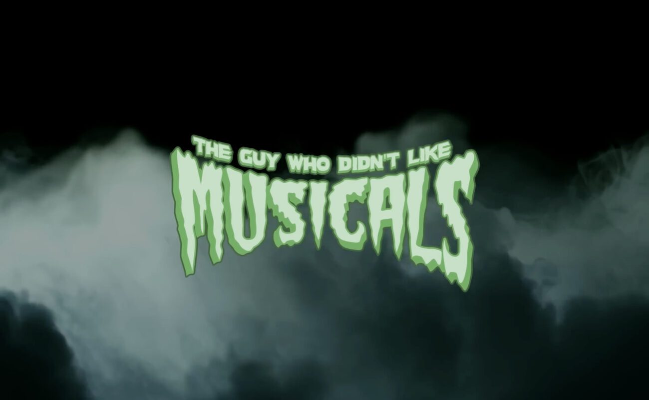 Green, spooky letters with green smoke billowing behind them spell the title, "The Guy Who Didn't Like Musicals."