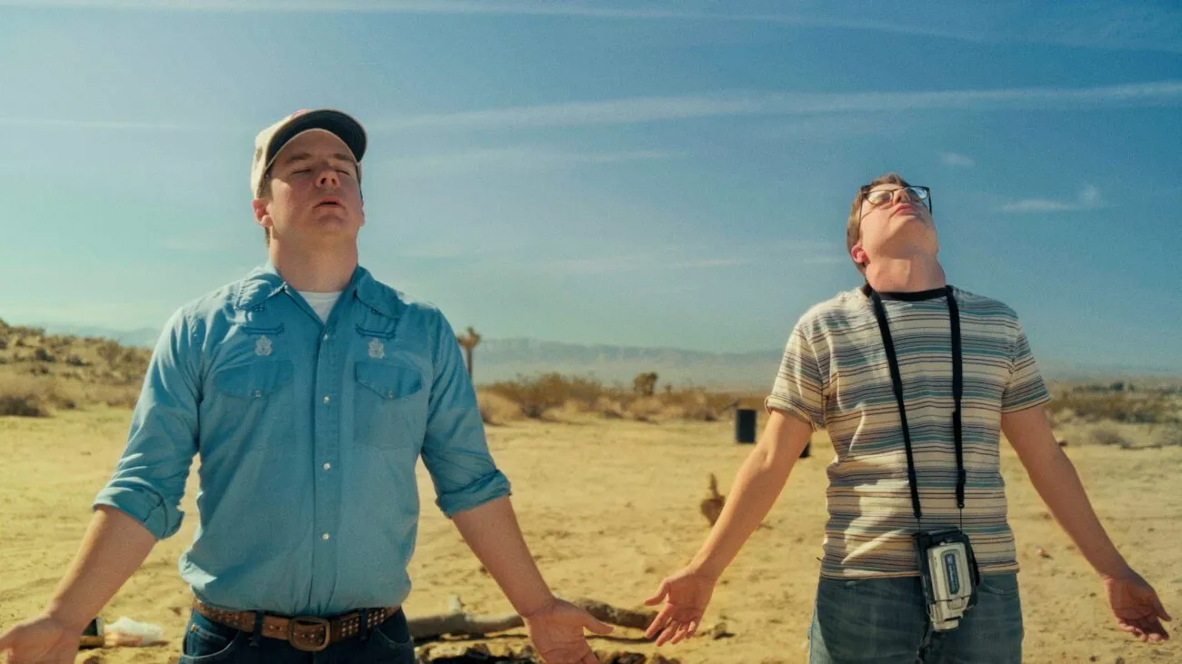 Two people standing in the desert