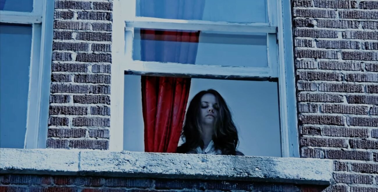 A woman looking out a window