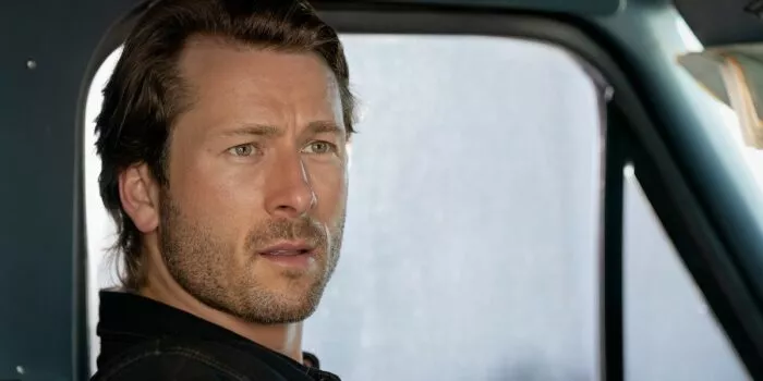 A close up shot of Glen Powell in Hit Man