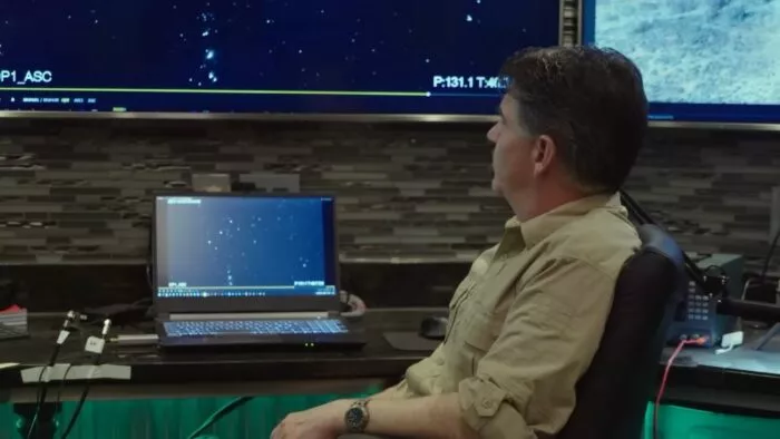 Erik Bard sits back in his chair and looks at the Command Center computer