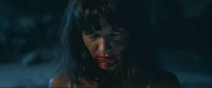 A woman with blood on her face