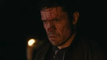 A man covered in blood